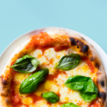 pizza topped with basil